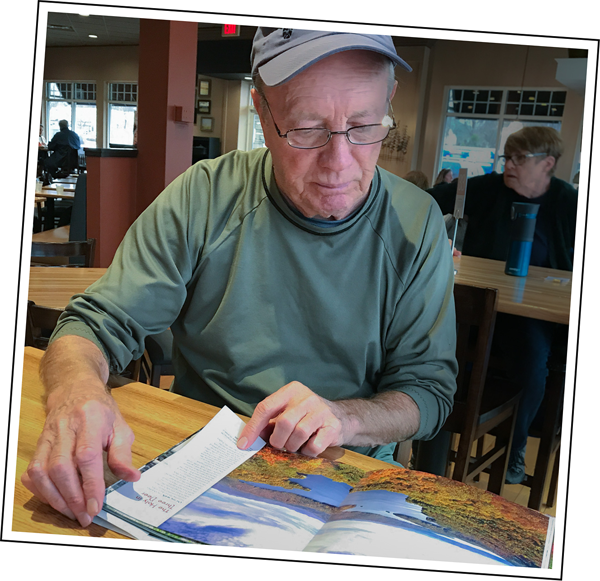 Bill Robertson studies the press proofs.